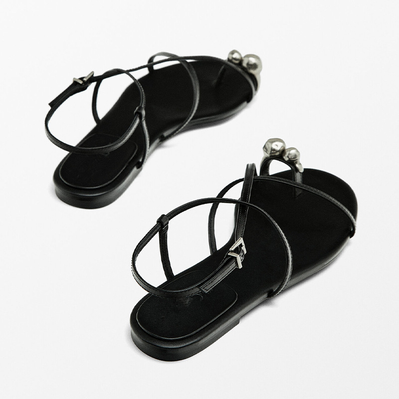 hot 2025 Women's genuine leather metal toe-ring Roman summer style open-toe flat sole one-word cross strap sandals new design