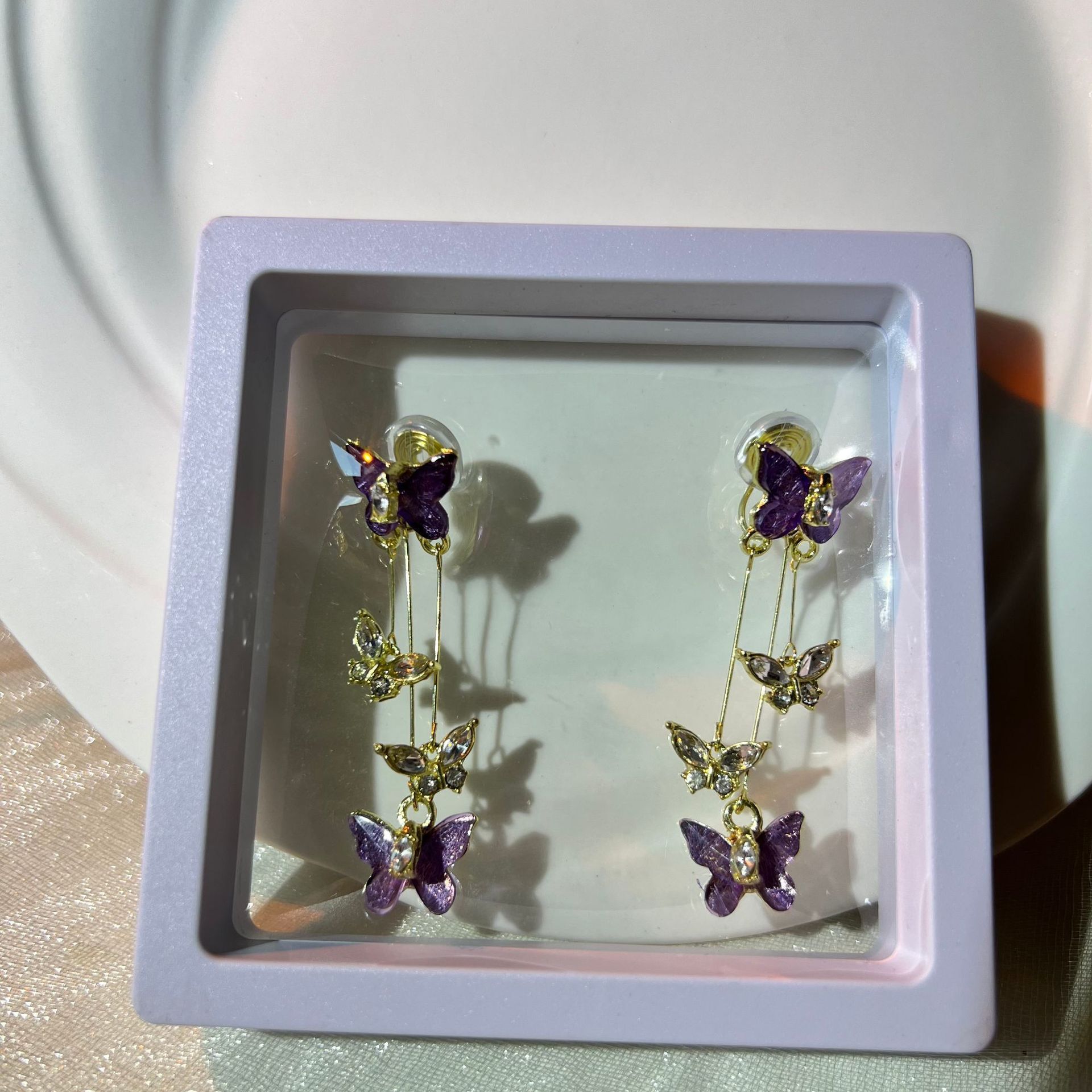 Digging into treasure, which girl would refuse the super beautiful purple crystal butterfly earrings, tassel style earrings