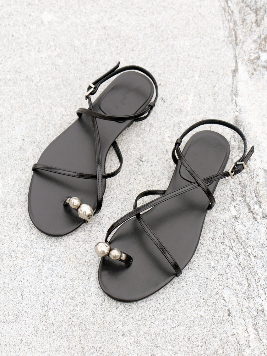 hot 2025 Women's genuine leather metal toe-ring Roman summer style open-toe flat sole one-word cross strap sandals new design