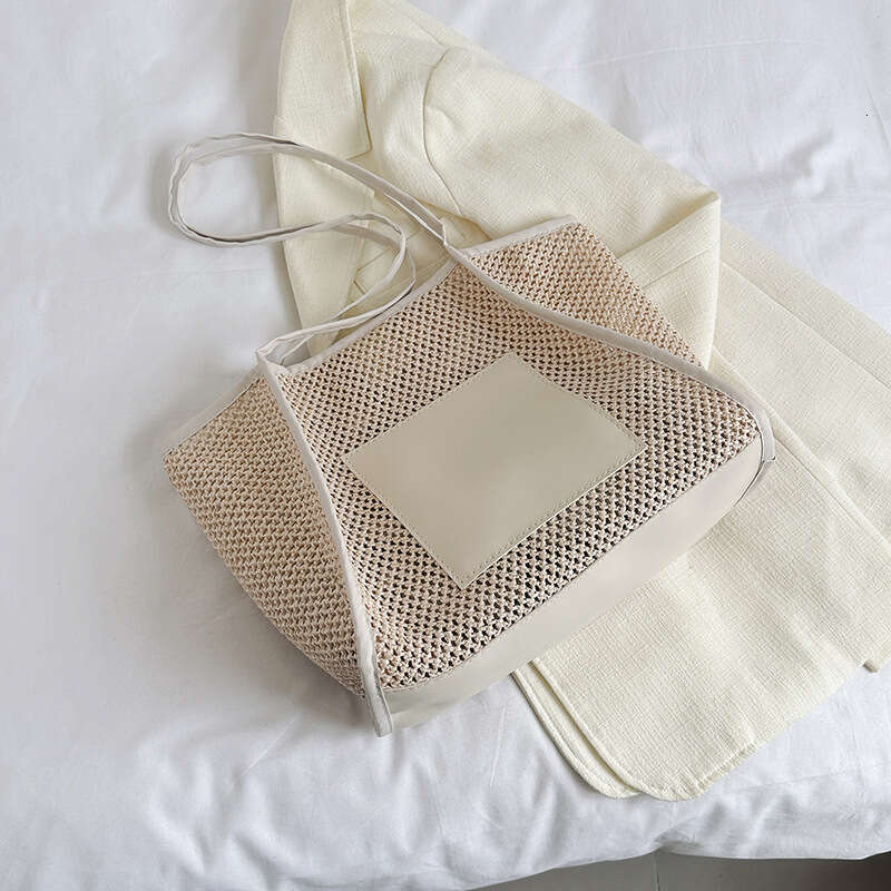 Design sense grass woven for women with large capacity hollowed out single shoulder beach bun mother commuting tote bag 2025 new casual versatile fash