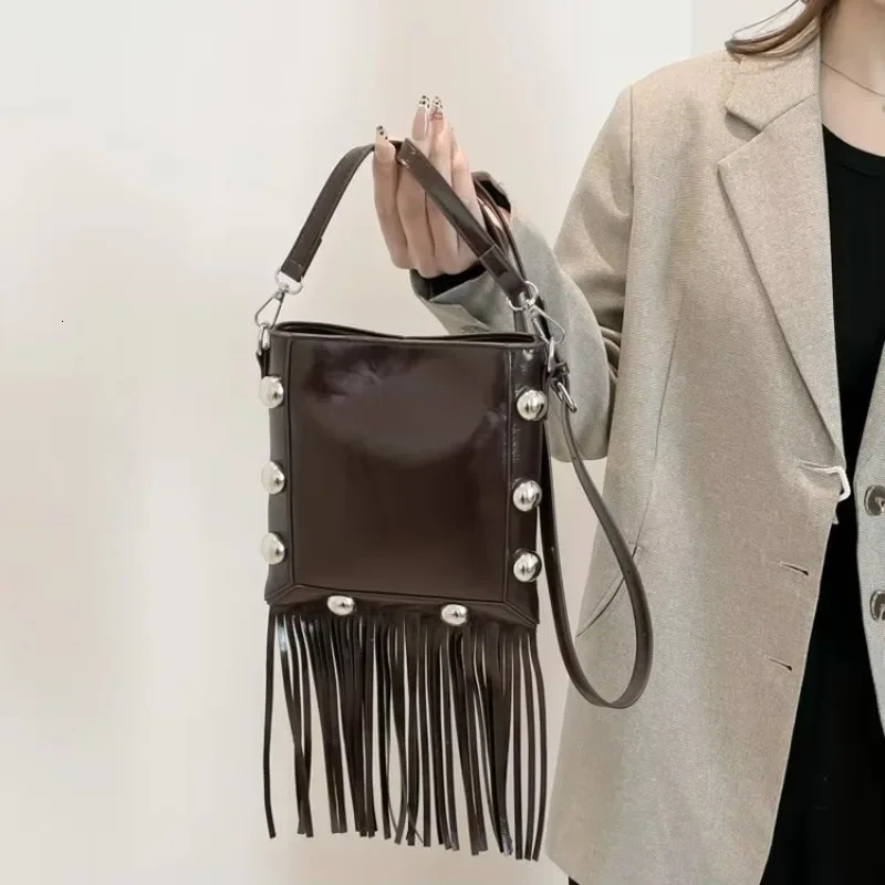 Tassel buckle shoulder bag PU solid color rivet highquality womens fashion version ethnic cross body 250408