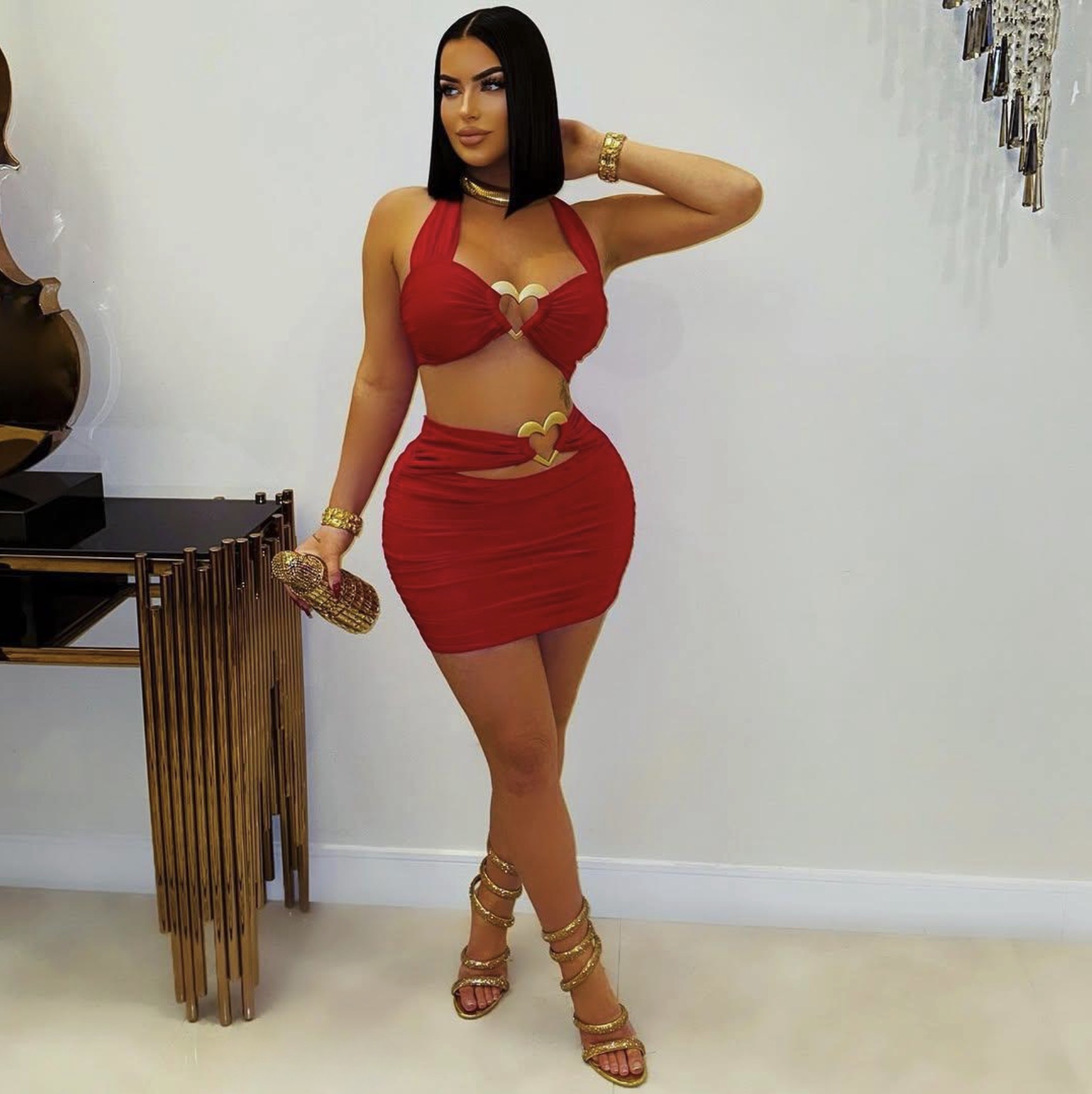 2025S Designer Women S Set New Solid Color Fashionable Slim Fit Sexy Metal Hanging Neck Short Top Hip Hugging Skirt Set