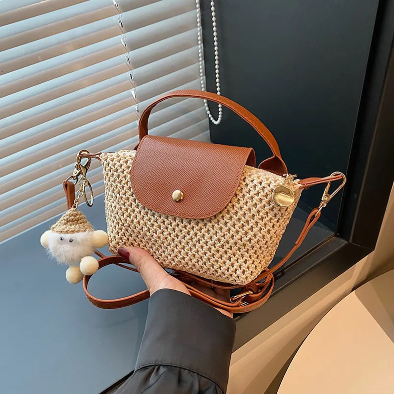 Luxury Brand Designer 2025 Summer New Ins-Style Niche Spliced Woven Bag, Pom-Pom Decor Beach Vacation Mini Handheld Straw Dumpling Women's Bag