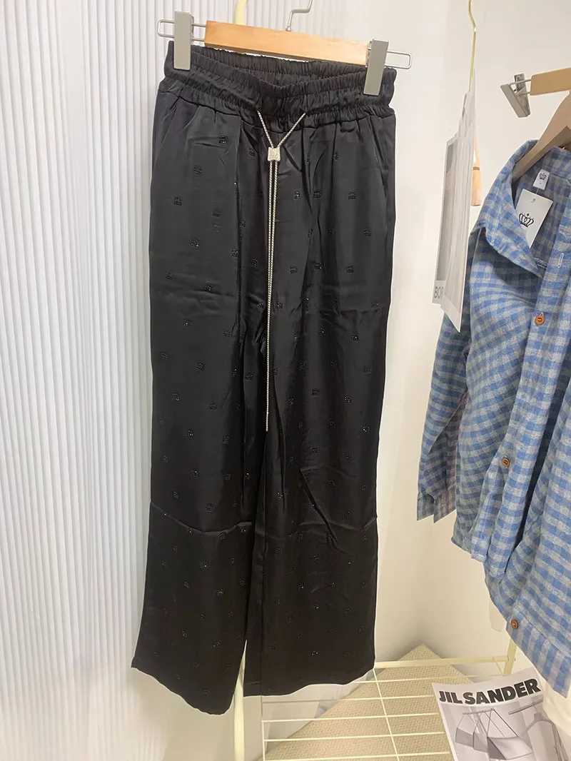 Acetate satin high waisted narrow leg pants suitable for women high waisted loose fit loose letters hot stamping unique tight pantsXJ250403