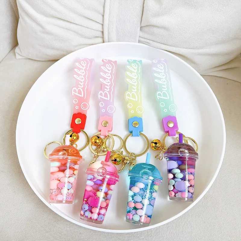 Luminous Camellia Cup Keychain Car Suspension Decoration Floating Quicksand Couple Bag KeychainXJ250409