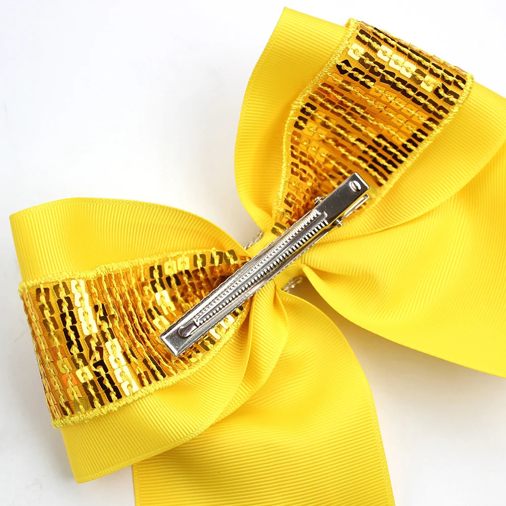 Free delivery of 12 sequined cheerleading bow shaped solid color swan tail hair clips sparkling girl hair bow accessories 250409