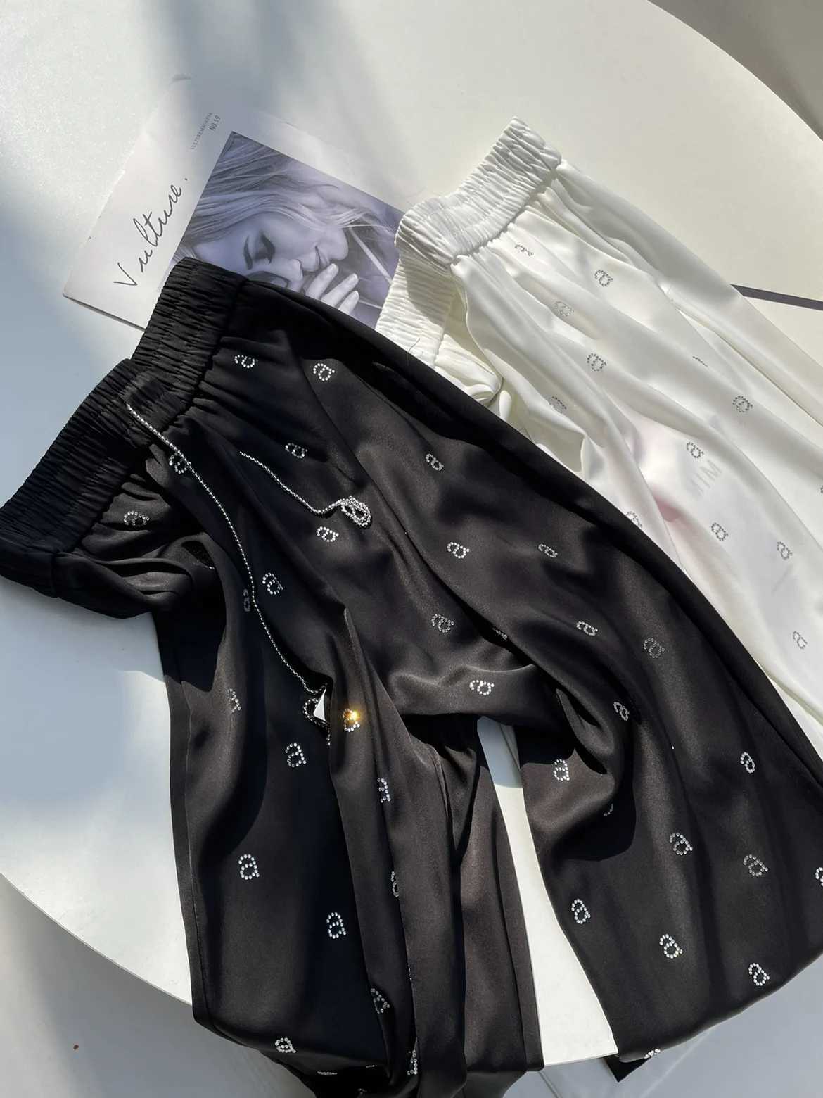 Acetate satin high waisted narrow leg pants suitable for women high waisted loose fit loose letters hot stamping unique tight pantsXJ250403