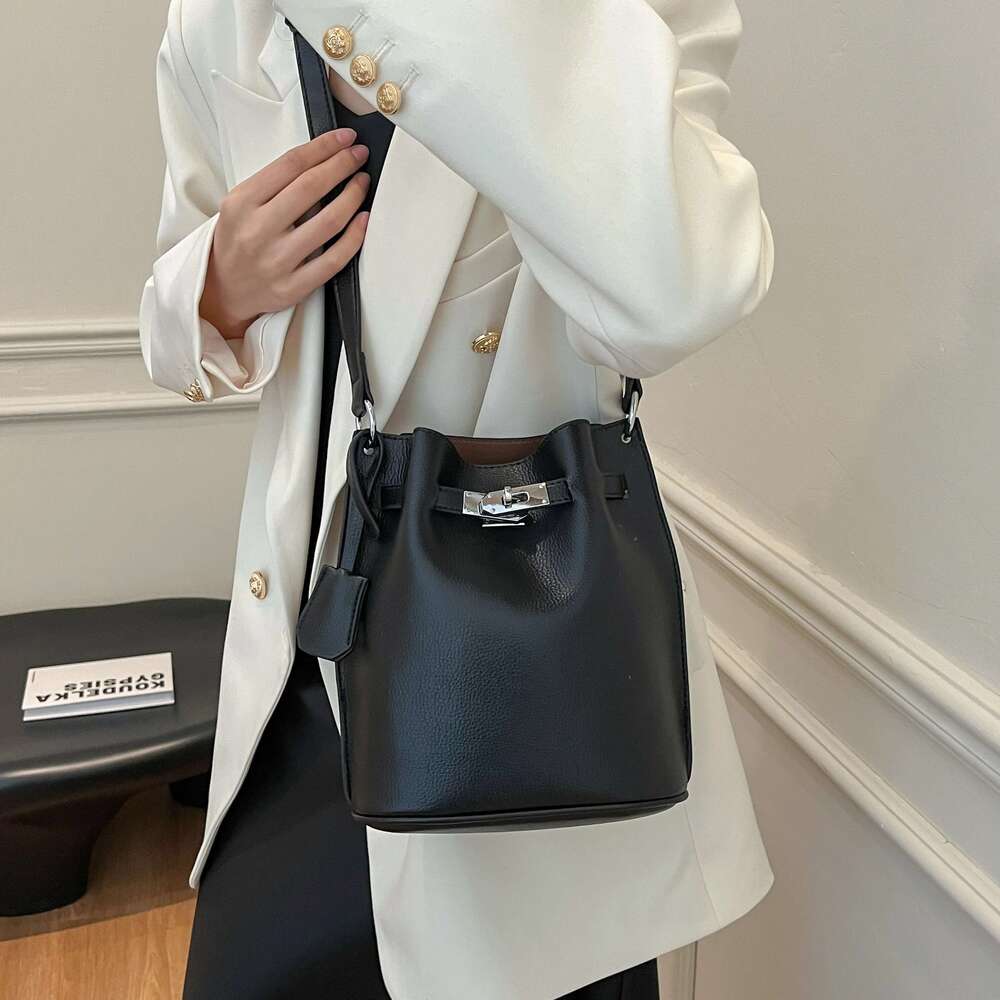 Simple Bucket Bag For Women's Daily Outings. A High - Quality Leather Bucket Bag In A Deep Brown Color, Exquisitely Adorned With