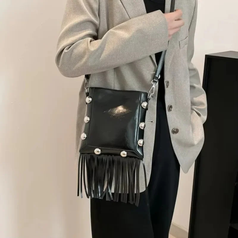Tassel buckle shoulder bag PU solid color rivet highquality womens fashion version ethnic cross body 250408
