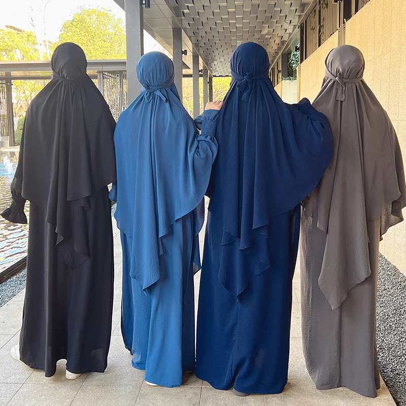 Muslim leader Khimar Jilbab Turban women wrapped in prayer scarves on their heads during Ramadan Abaya Islamic Dubai Saudi Arabia humble Niqab headsca