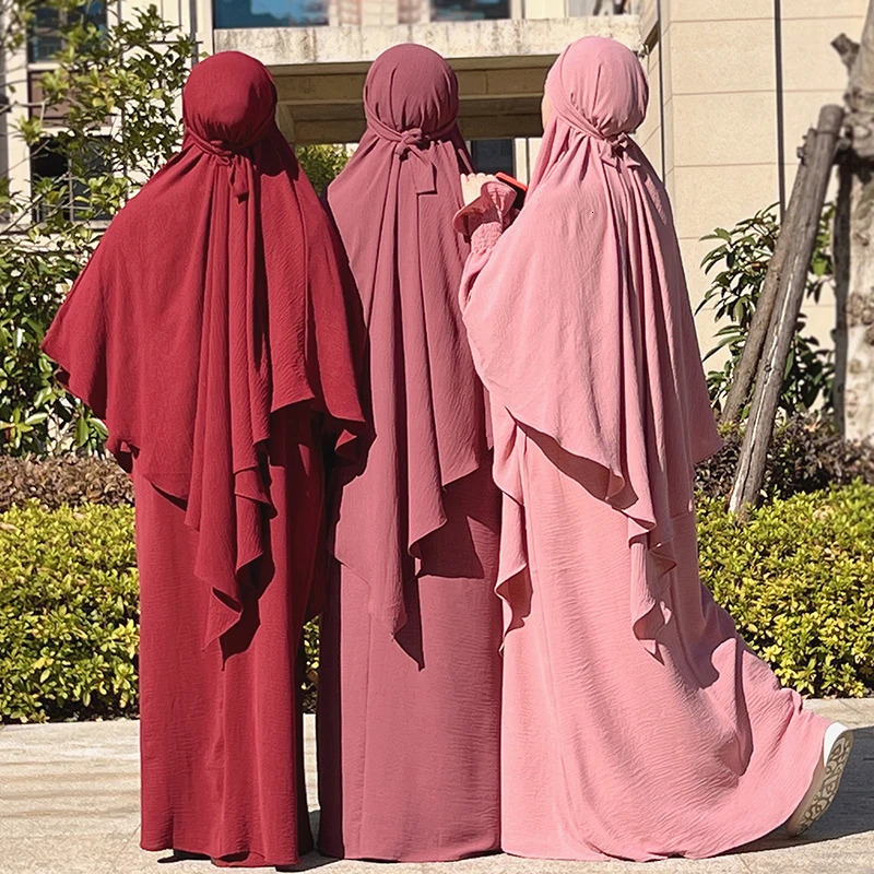 Muslim leader Khimar Jilbab Turban women wrapped in prayer scarves on their heads during Ramadan Abaya Islamic Dubai Saudi Arabia humble Niqab headsca