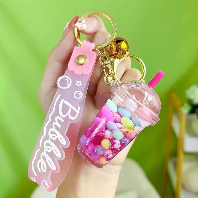 Luminous Camellia Cup Keychain Car Suspension Decoration Floating Quicksand Couple Bag KeychainXJ250409