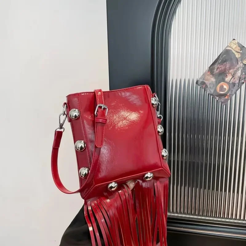 Tassel buckle shoulder bag PU solid color rivet highquality womens fashion version ethnic cross body 250408