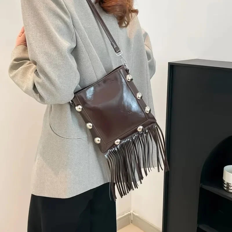 Tassel buckle shoulder bag PU solid color rivet highquality womens fashion version ethnic cross body 250408