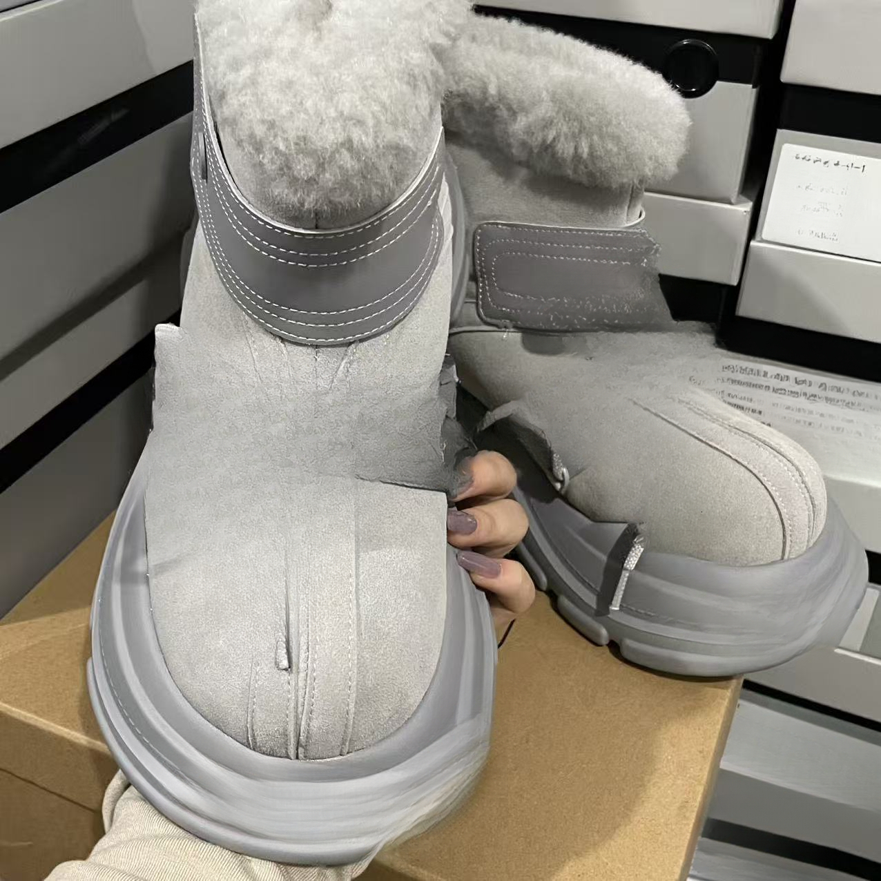 Designer snow boots with closed toe, thick sole, increased warmth, lace up, waterproof, anti slip, cowhide, wool, designer shoes