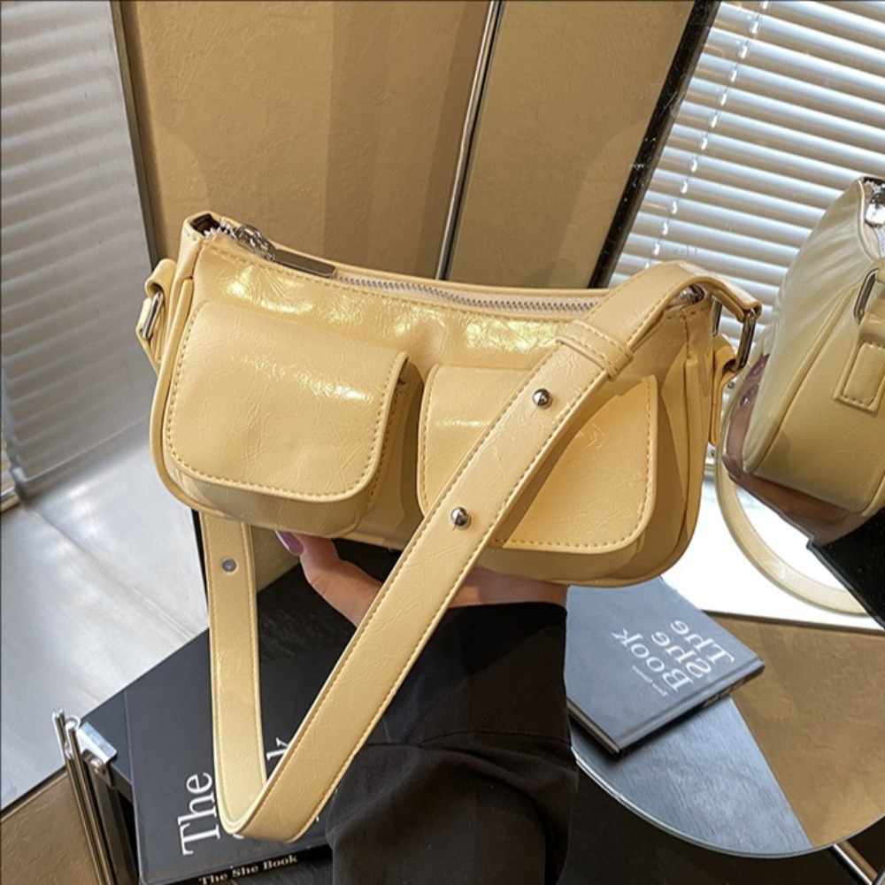 Chic Unisex Travel Companion: Durable Padded Strap underarm bag with multiple compartments for everyday use.