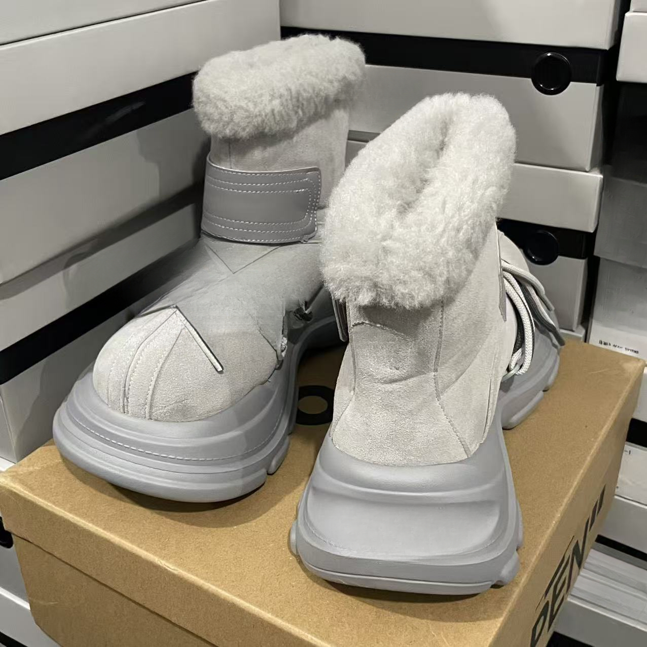 Designer snow boots with closed toe, thick sole, increased warmth, lace up, waterproof, anti slip, cowhide, wool, designer shoes