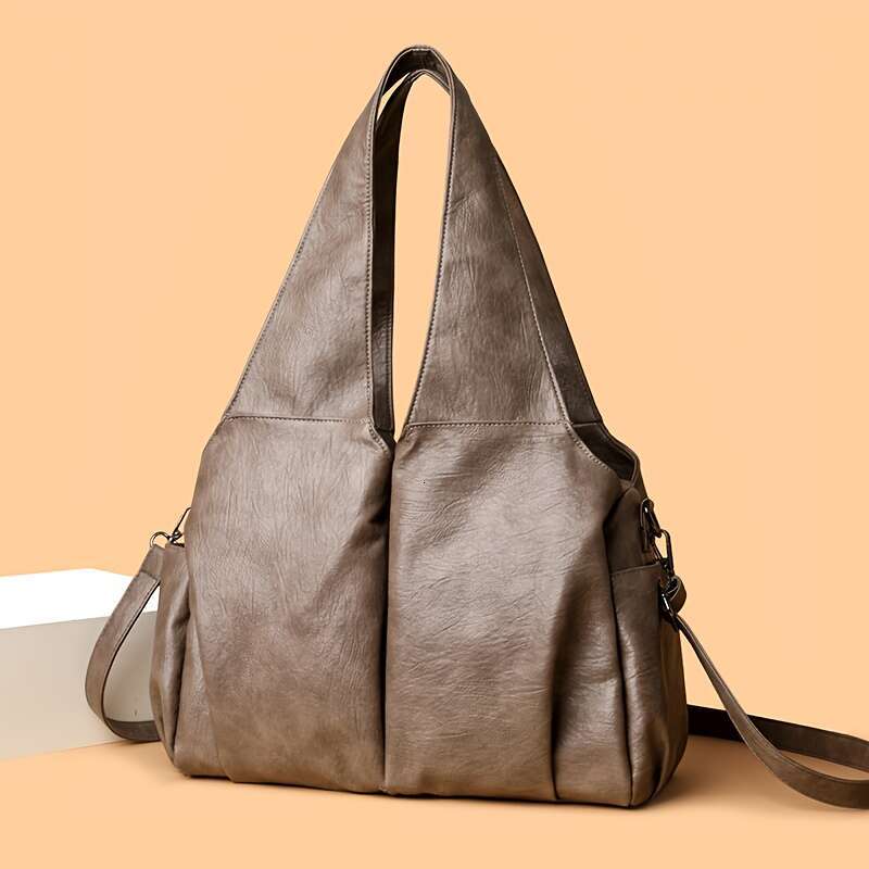 Vintage Style Women S Handbag Featuring An Elegant V Shaped Silhouette Soft Leather Offers Delicate Touch And Versatile Carrying Options That Easily