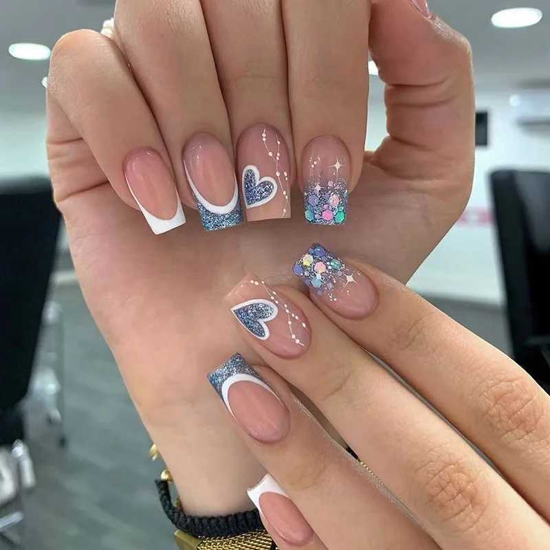 24 pieces of blue sparkling short fake nails with heart-shaped design full coverage of fake nail art waterproof detachable and pressure resistant nail