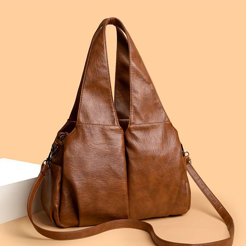 Vintage Style Women S Handbag Featuring An Elegant V Shaped Silhouette Soft Leather Offers Delicate Touch And Versatile Carrying Options That Easily