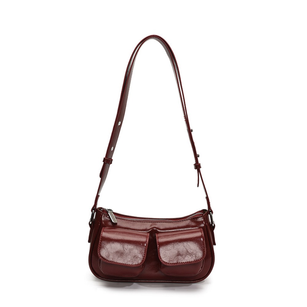 Chic Unisex Travel Companion: Durable Padded Strap underarm bag with multiple compartments for everyday use.