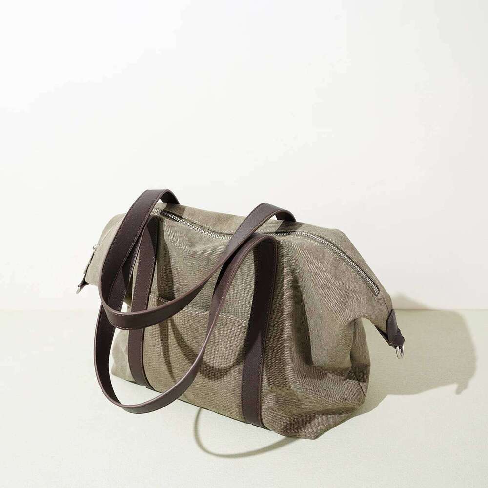 Canvas Travel Tote Bag New Niche Design Simple Casual Large Capacity Men And Women Same Fashion Hand-Laundry Shoulder Bag 251110