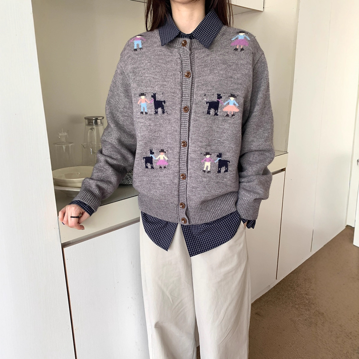 Cardigan sweater women's 2025 autumn and winter new Korean designer lazy loose slimming versatile button round neck knitted jacket