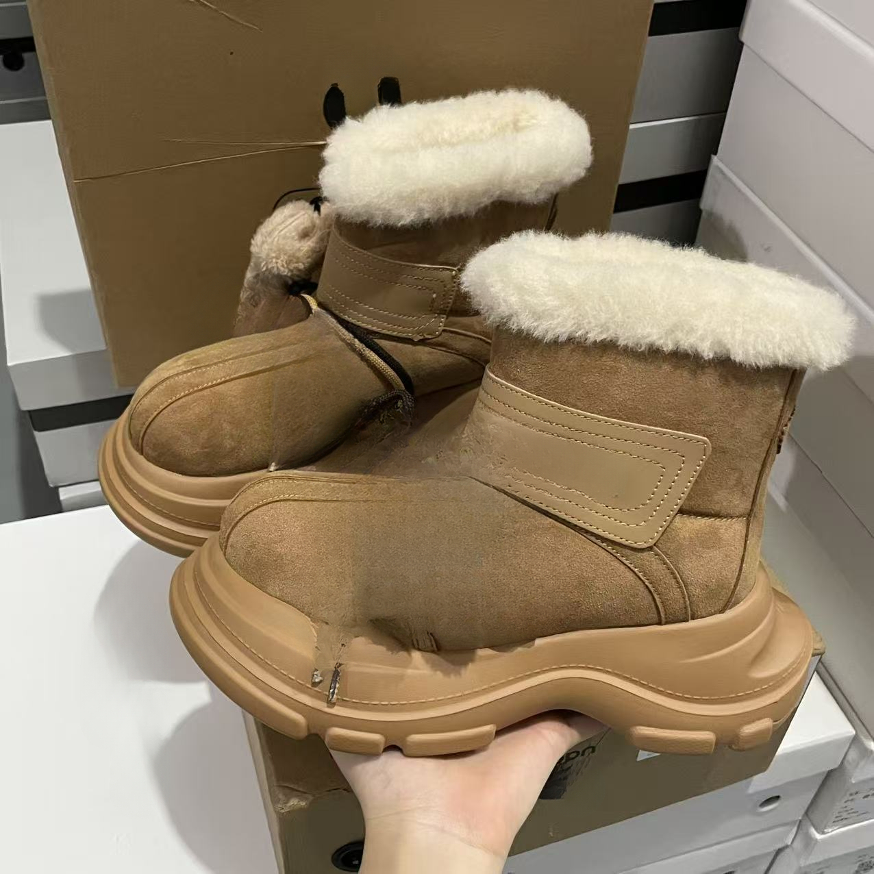 Designer snow boots with closed toe, thick sole, increased warmth, lace up, waterproof, anti slip, cowhide, wool, designer shoes