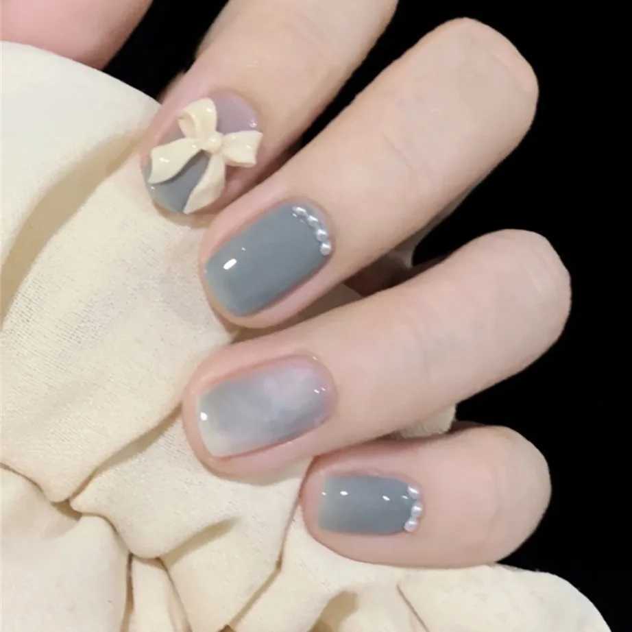 24 pieces of blue sparkling short fake nails with heart-shaped design full coverage of fake nail art waterproof detachable and pressure resistant nail