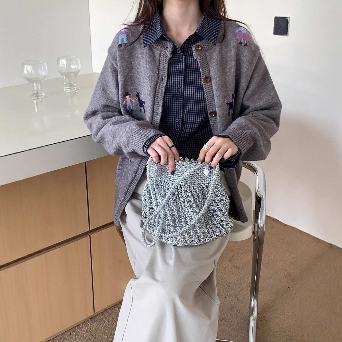 Cardigan sweater women's 2025 autumn and winter new Korean designer lazy loose slimming versatile button round neck knitted jacket