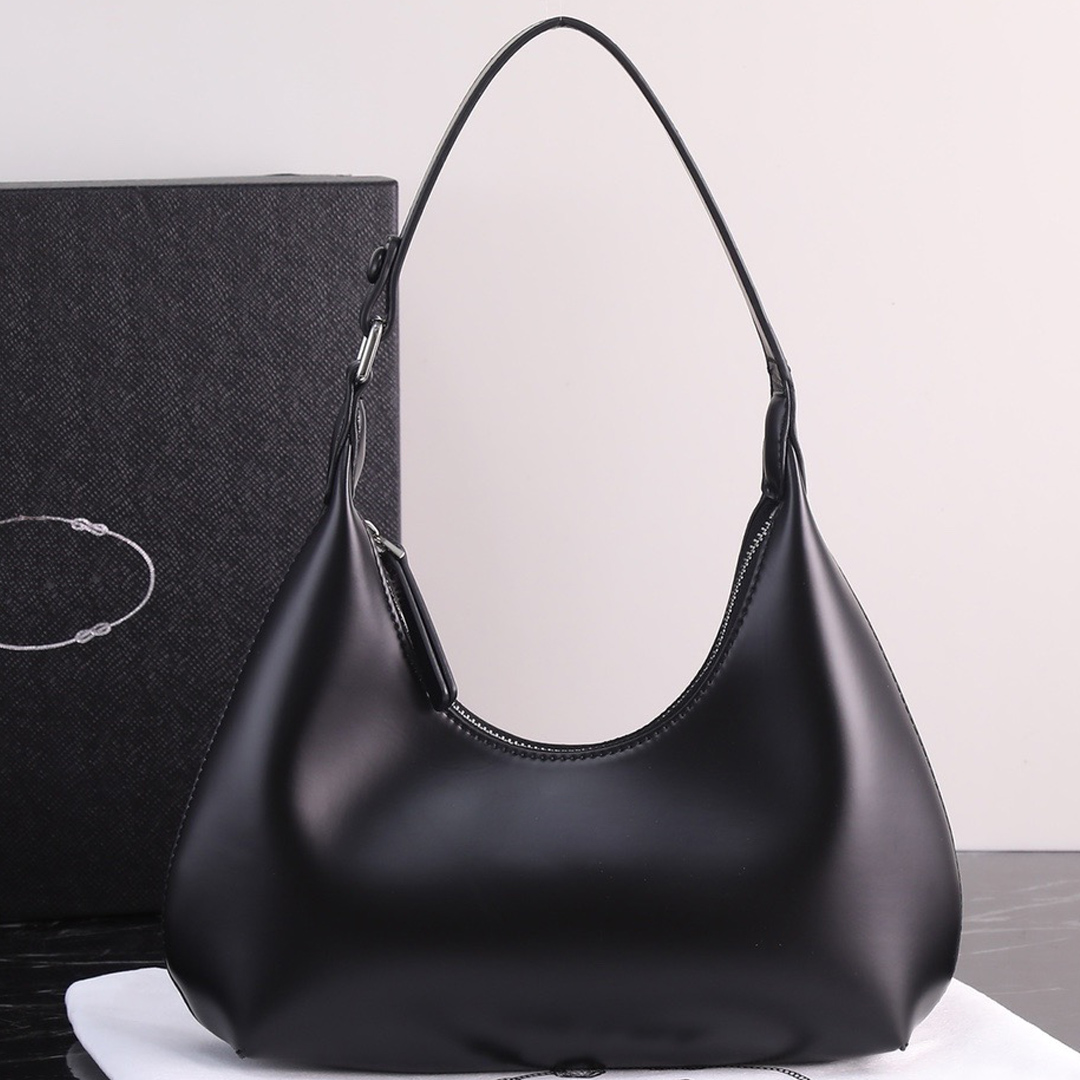 Arque small leather shoulder bag Nappa leather interior detachable and adjustable leather handle with enamel metal logo on the front and zipper closure