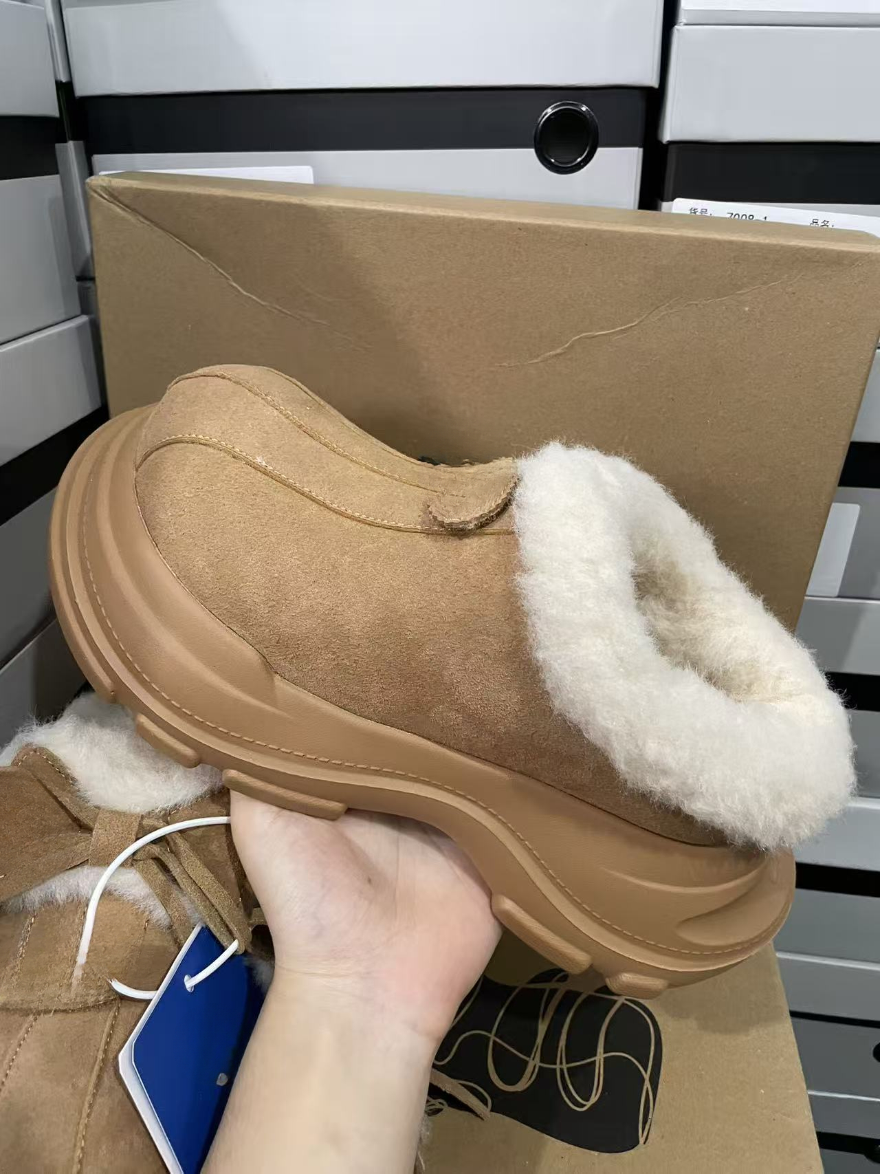 Designer snow boots with closed toe, thick sole, increased warmth, lace up, waterproof, anti slip, cowhide, wool, designer shoes