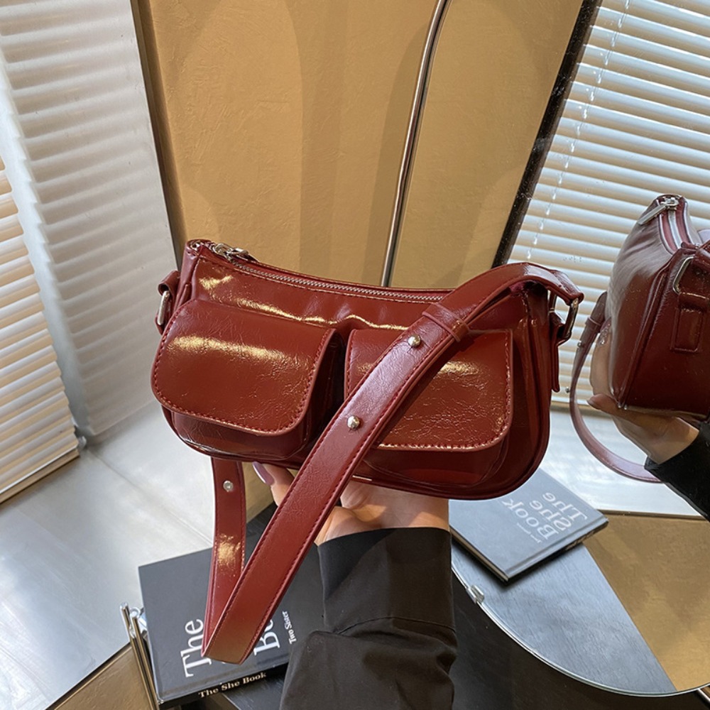 Chic Unisex Travel Companion: Durable Padded Strap underarm bag with multiple compartments for everyday use.