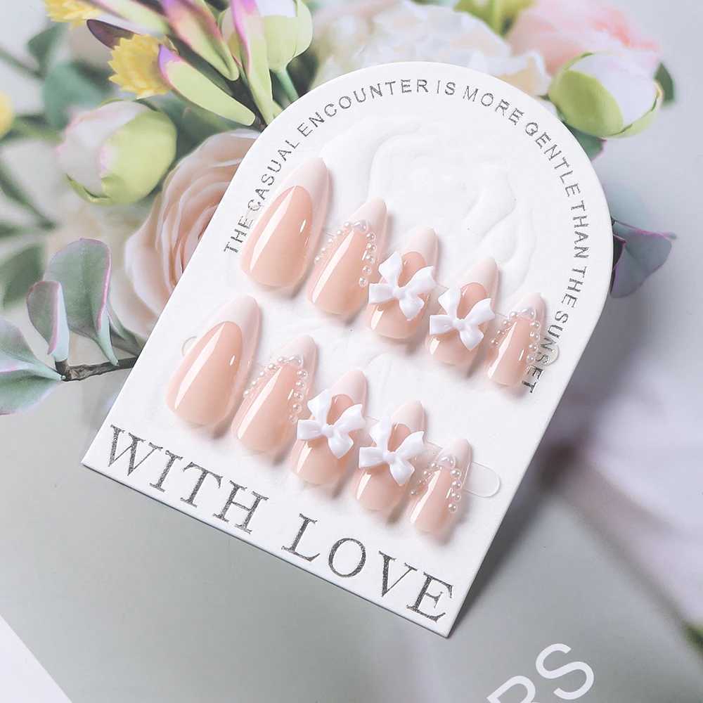 24 pieces (+tools) Pearl Bow Nude Pink Pressing Nails White French Fingertips Almond Full Set Fasle Nail New Year Nail Accessories W250410