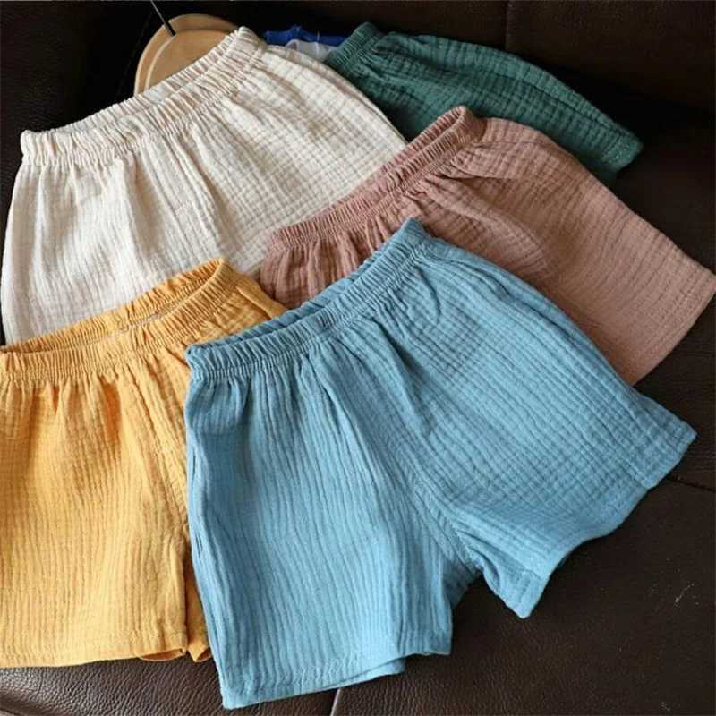 Cotton linen childrens girls shorts solid color summer boys five point pants childrens baby clothing Z250410