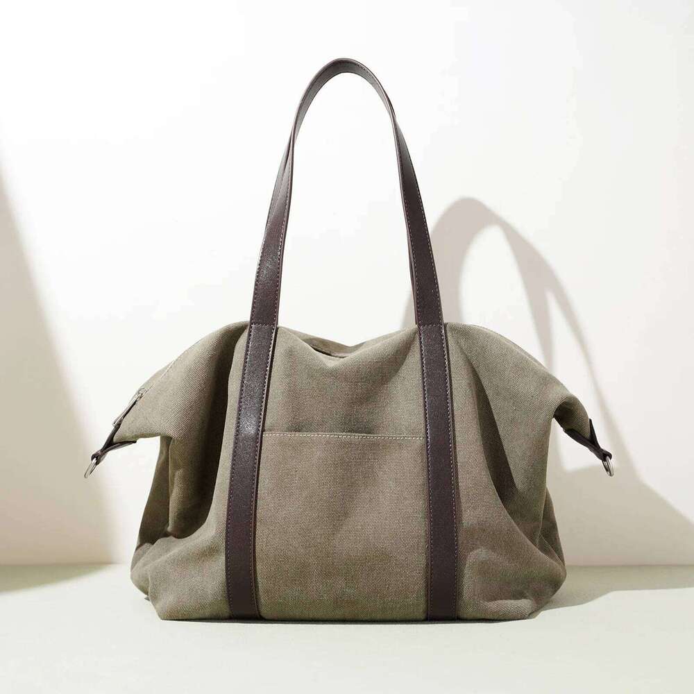 Canvas Travel Tote Bag New Niche Design Simple Casual Large Capacity Men And Women Same Fashion Hand-Laundry Shoulder Bag 251110