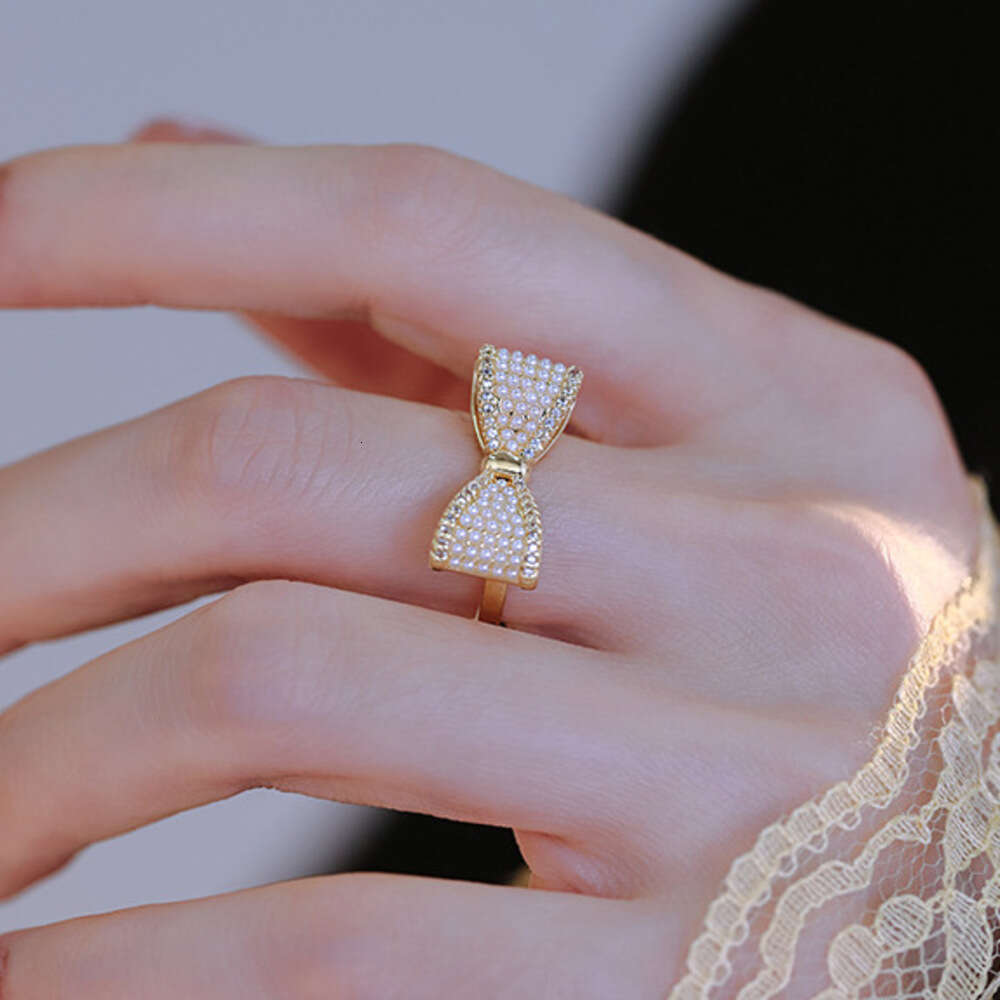 DHcollections Gentle Fairy Style Big Bow Pearl French Retro High-end Light Luxury Versatile Elegant Index Finger Ring for Women