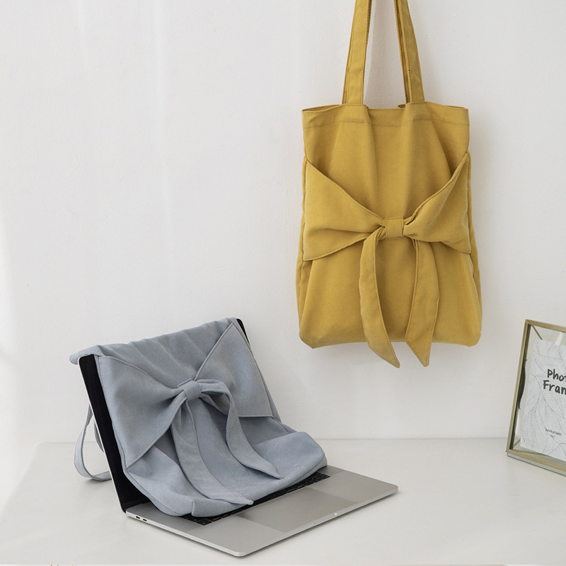 2025S New Model Designer Bag Bowtie Tote Artistic Single Shoulder Women S Student Canvas Bag Niche Design Large Capacity Handbag Totebag