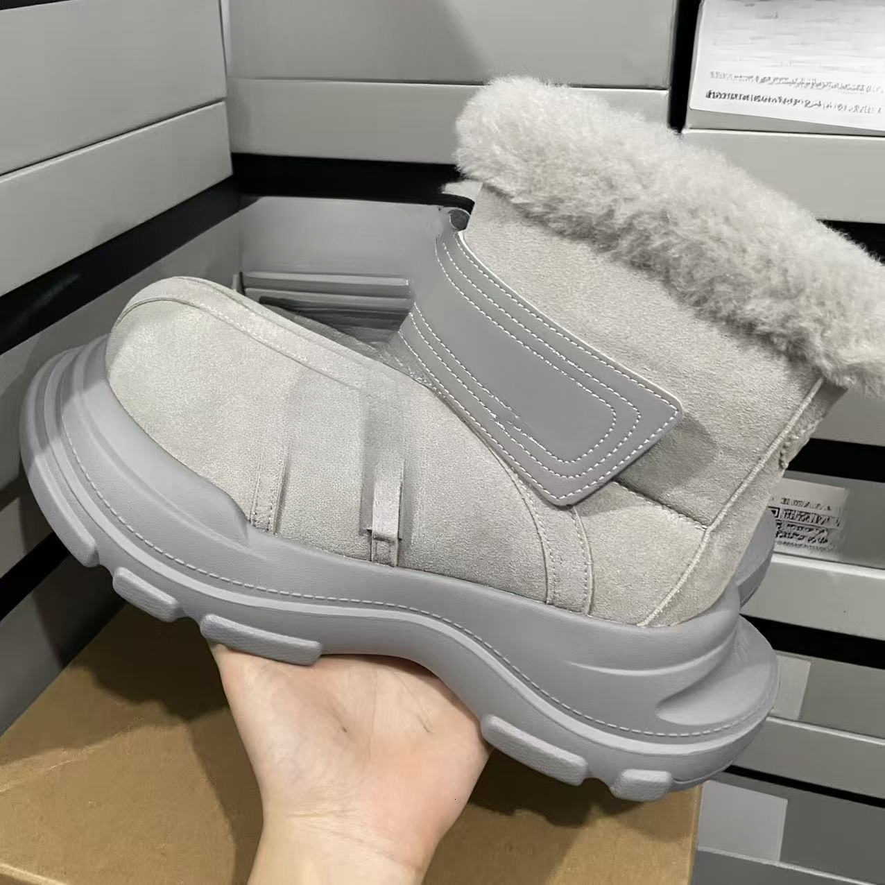 Designer snow boots with closed toe, thick sole, increased warmth, lace up, waterproof, anti slip, cowhide, wool, designer shoes