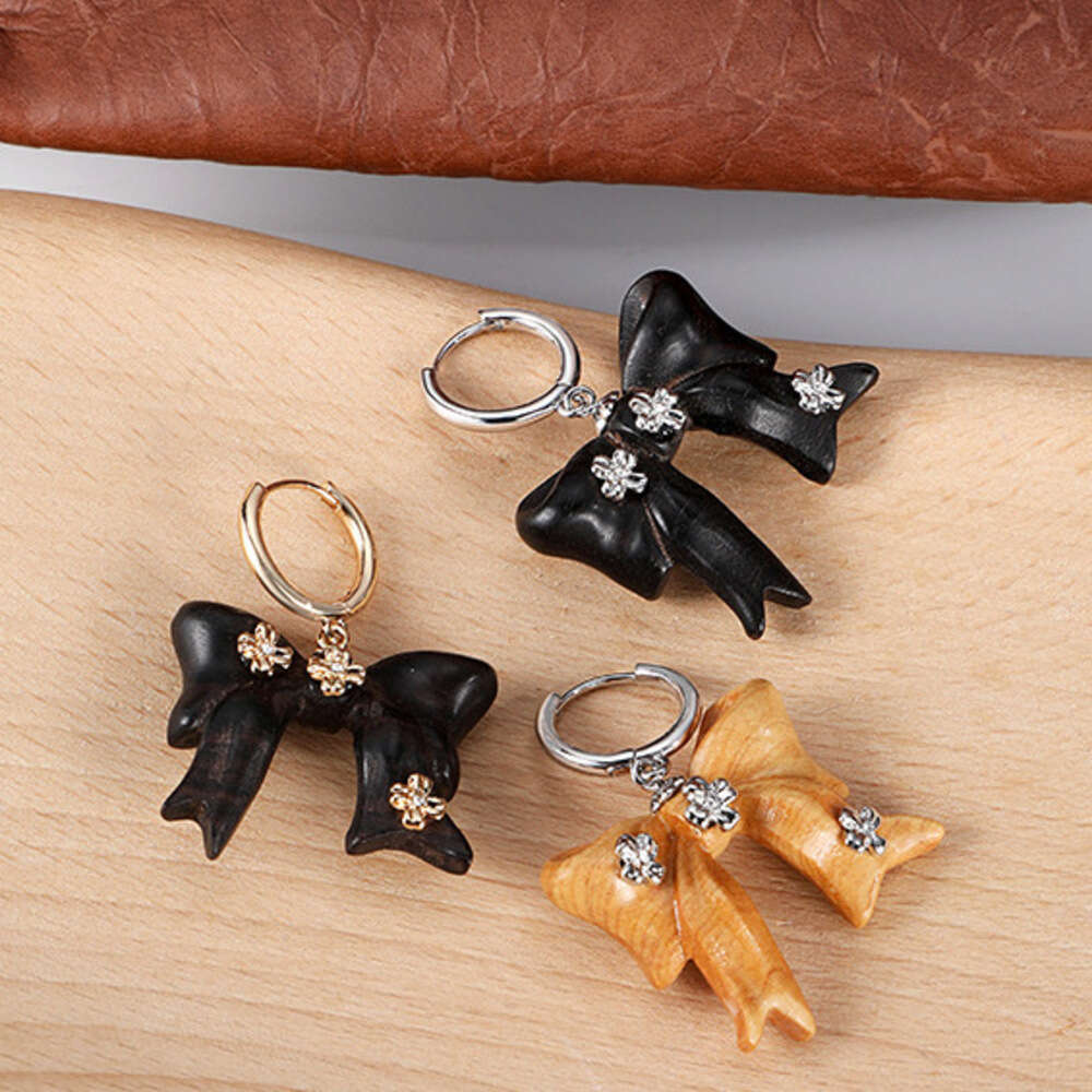 DHcollections Autumn Winter Melad Wooden Bow Earrings for Women, Light Luxury Niche Original Design, Elegant Versatile Clips and Ear Jewelry