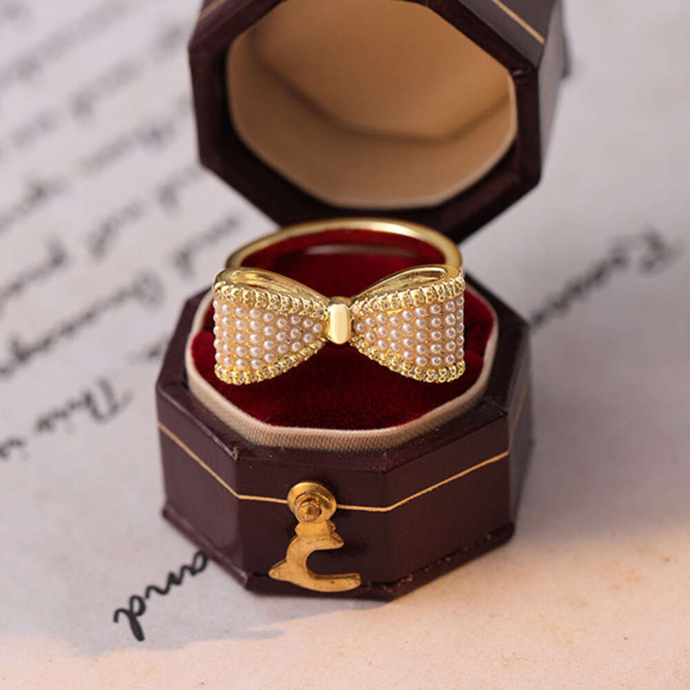 DHcollections Gentle Fairy Style Big Bow Pearl French Retro High-end Light Luxury Versatile Elegant Index Finger Ring for Women