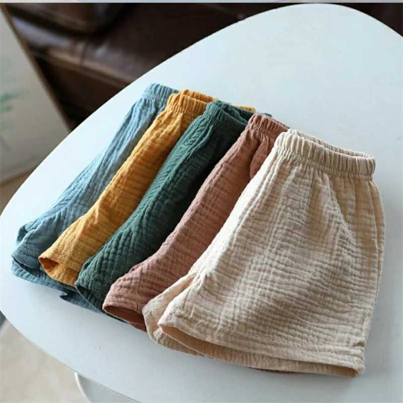Cotton linen childrens girls shorts solid color summer boys five point pants childrens baby clothing Z250410