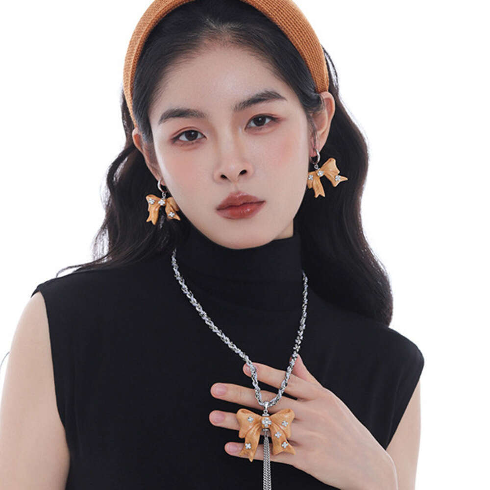 Vintage Original Design Wooden Bow Tassel Necklace for Women Unique Niche Light Luxury Long Pearl Sweater Chain