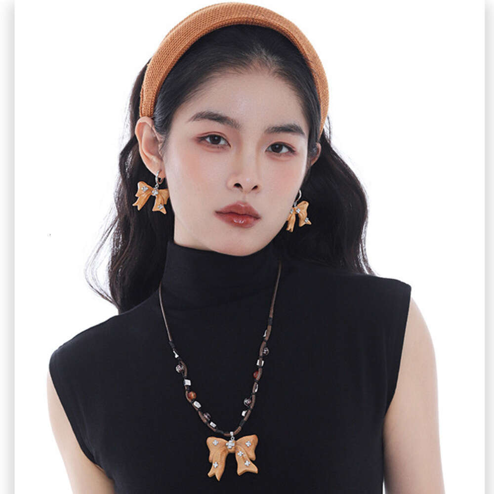 Milad Wooden Bow Pendant Necklace Women, Autumn and Winter Original Design, Light Luxury Niche High-end Sweater Chain for Women