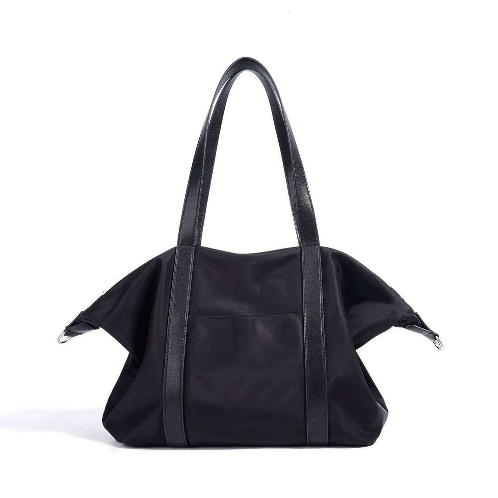 Canvas Travel Tote Bag New Niche Design Simple Casual Large Capacity Men And Women Same Fashion Hand-Laundry Shoulder Bag 251110