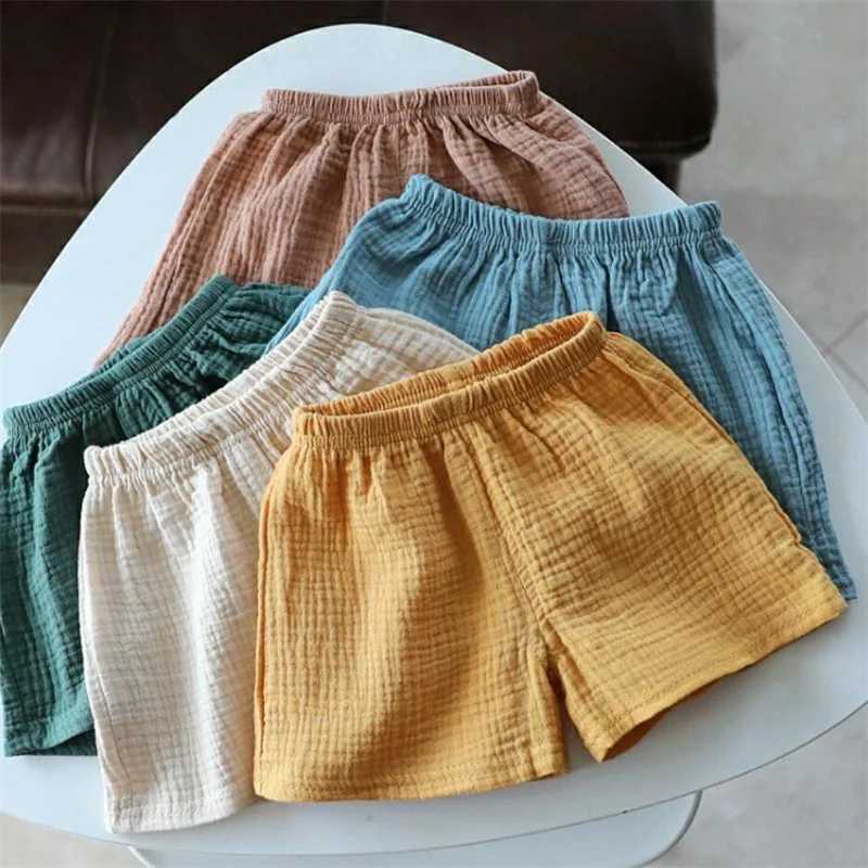 Cotton linen childrens girls shorts solid color summer boys five point pants childrens baby clothing Z250410