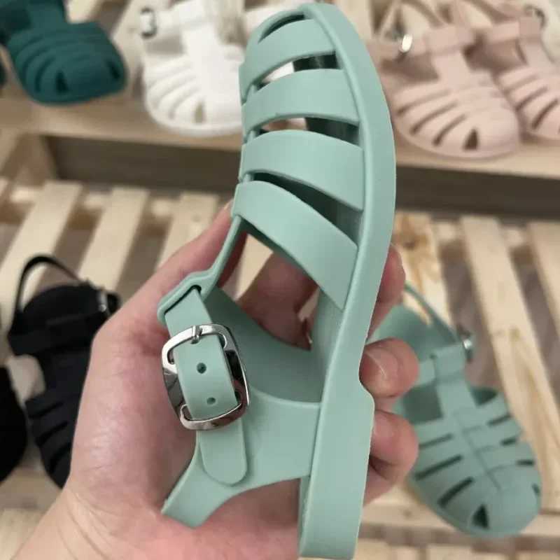 Summer baby sandals childrens Roman childrens hollow princess metal buckle shoes candy jelly beach shoes girls and boys sliders Z250410