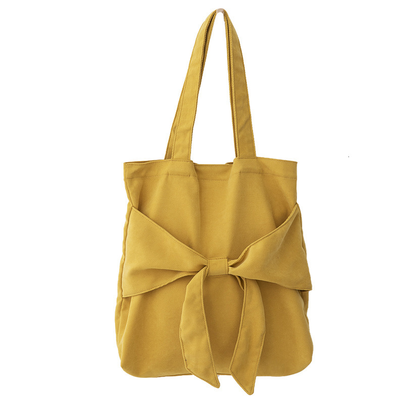 2025S New Model Designer Bag Bowtie Tote Artistic Single Shoulder Women S Student Canvas Bag Niche Design Large Capacity Handbag Totebag