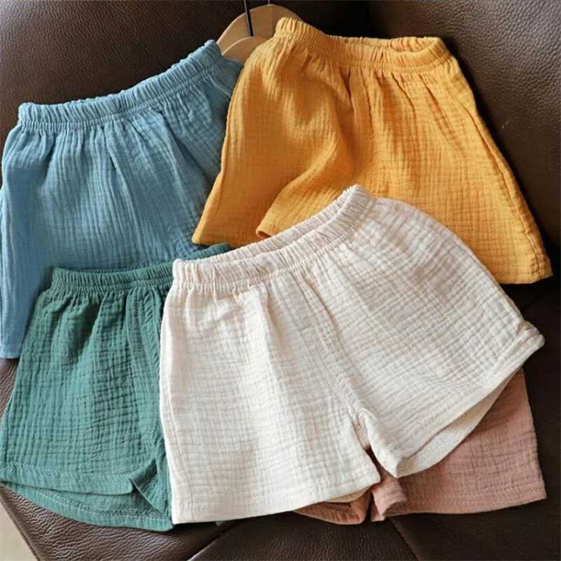 Cotton linen childrens girls shorts solid color summer boys five point pants childrens baby clothing Z250410
