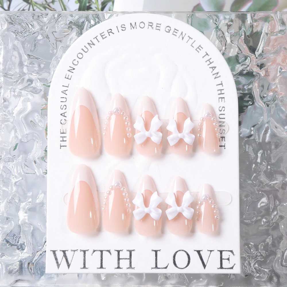 24 pieces (+tools) Pearl Bow Nude Pink Pressing Nails White French Fingertips Almond Full Set Fasle Nail New Year Nail Accessories W250410